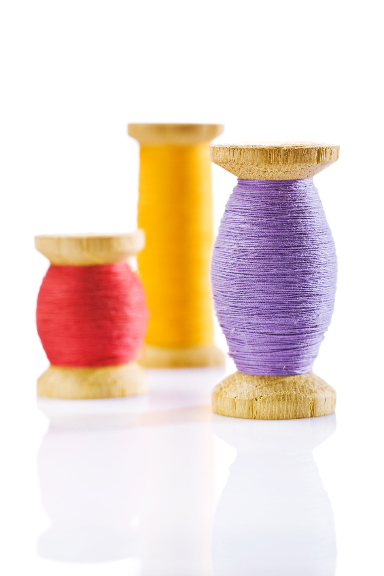 small: close-up colorful thread skeins and needle