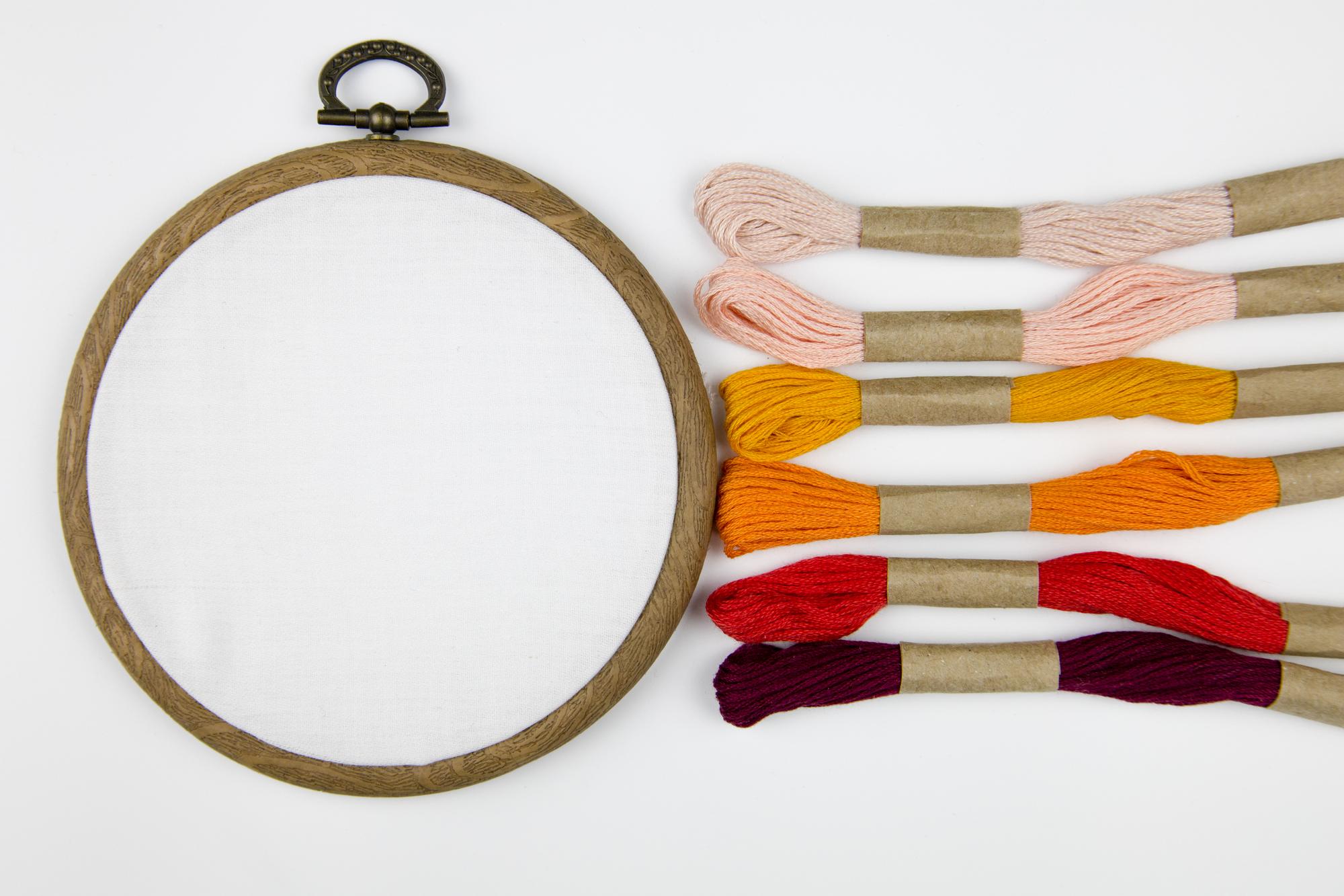 mainshot: close-up handcrafted embroidered textile on hoop